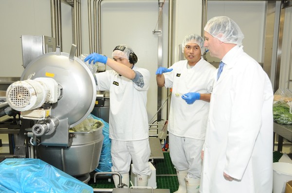LHF Factory staff show the Hon John Key how to make Lisa's Dips